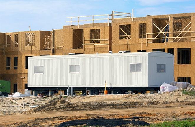 construction workers meeting at office trailers on rent in Cutler CA